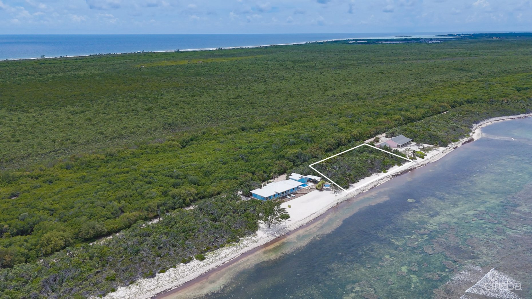 LITTLE CAYMAN BEACHFRONT HOME WITH 2 LOTS AND POOL