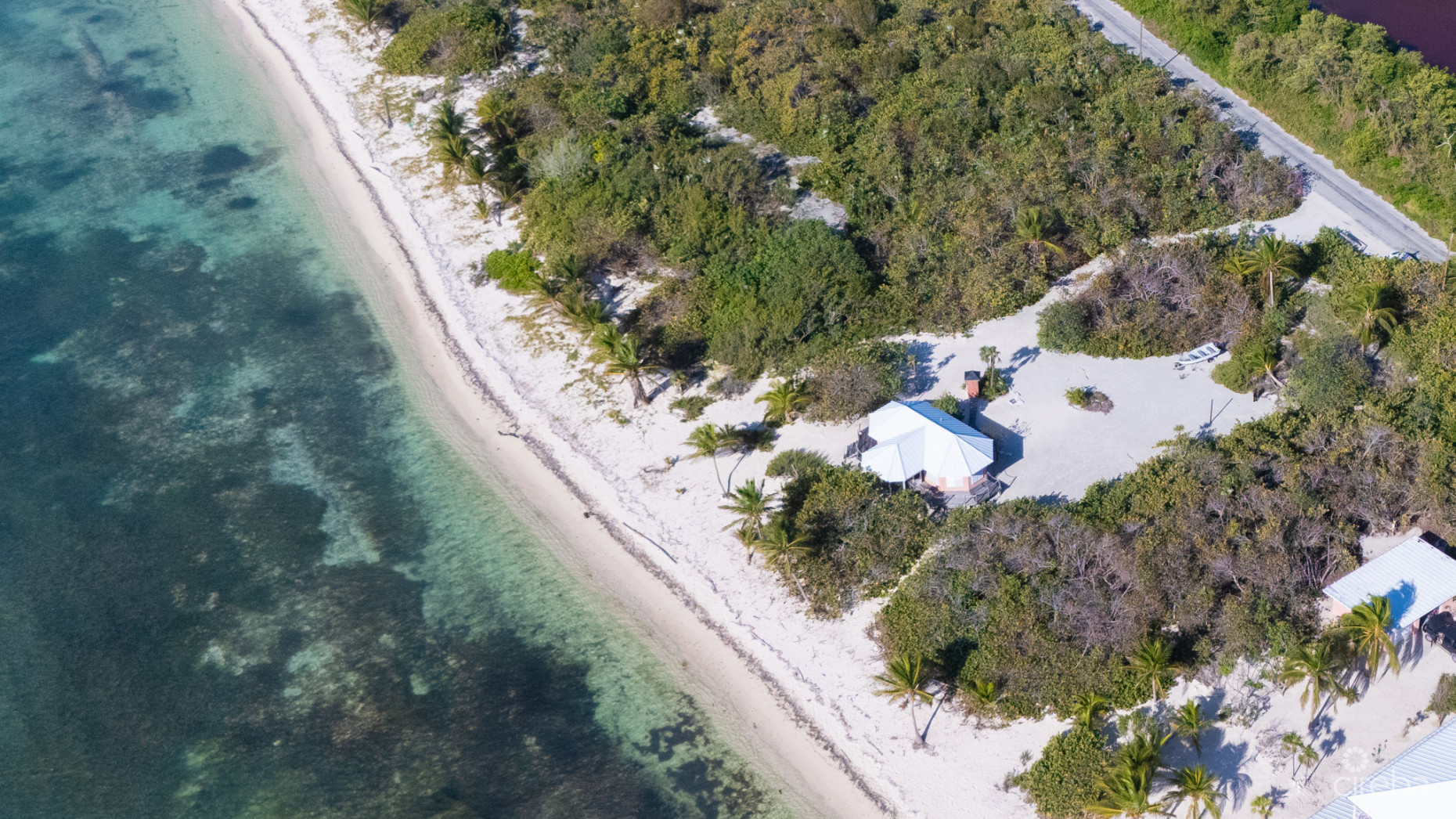 LITTLE CAYMAN LAND WITH BEACHFRONT COTTAGE