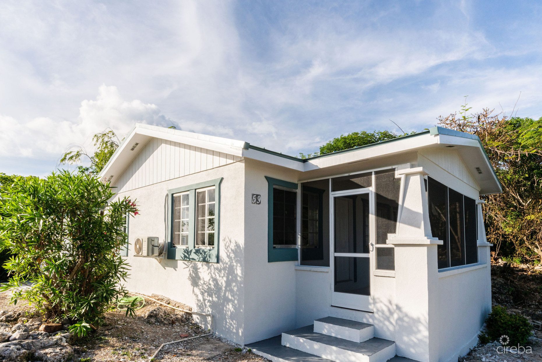 CHARMING OCEANVIEW COTTAGE ACROSS FROM THE SEA ON EXPANSIVE 0.89 ACRE LOT