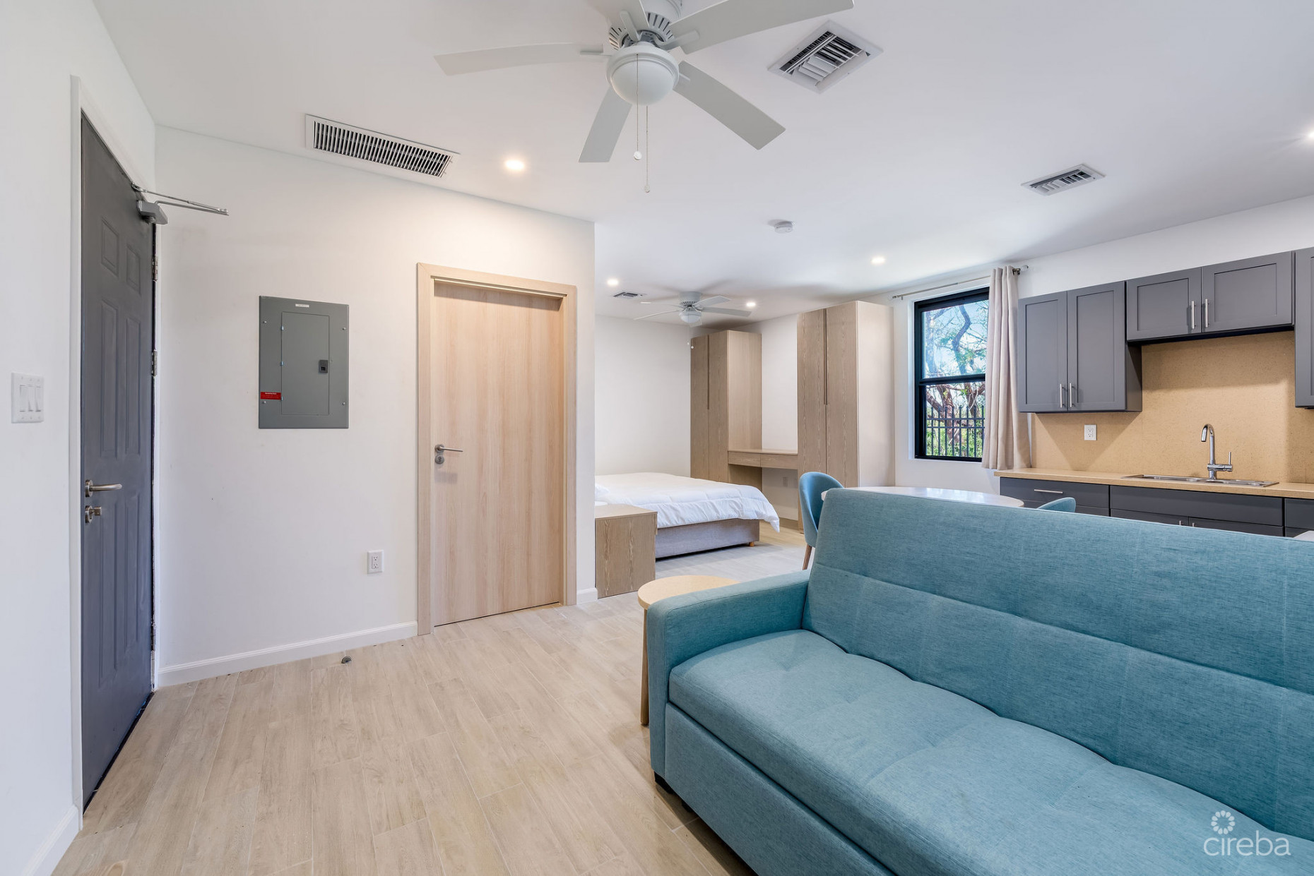 INCOME-PRODUCING RESIDENTIAL PORTFOLIO --4 STUDIOS IN WEST BAY