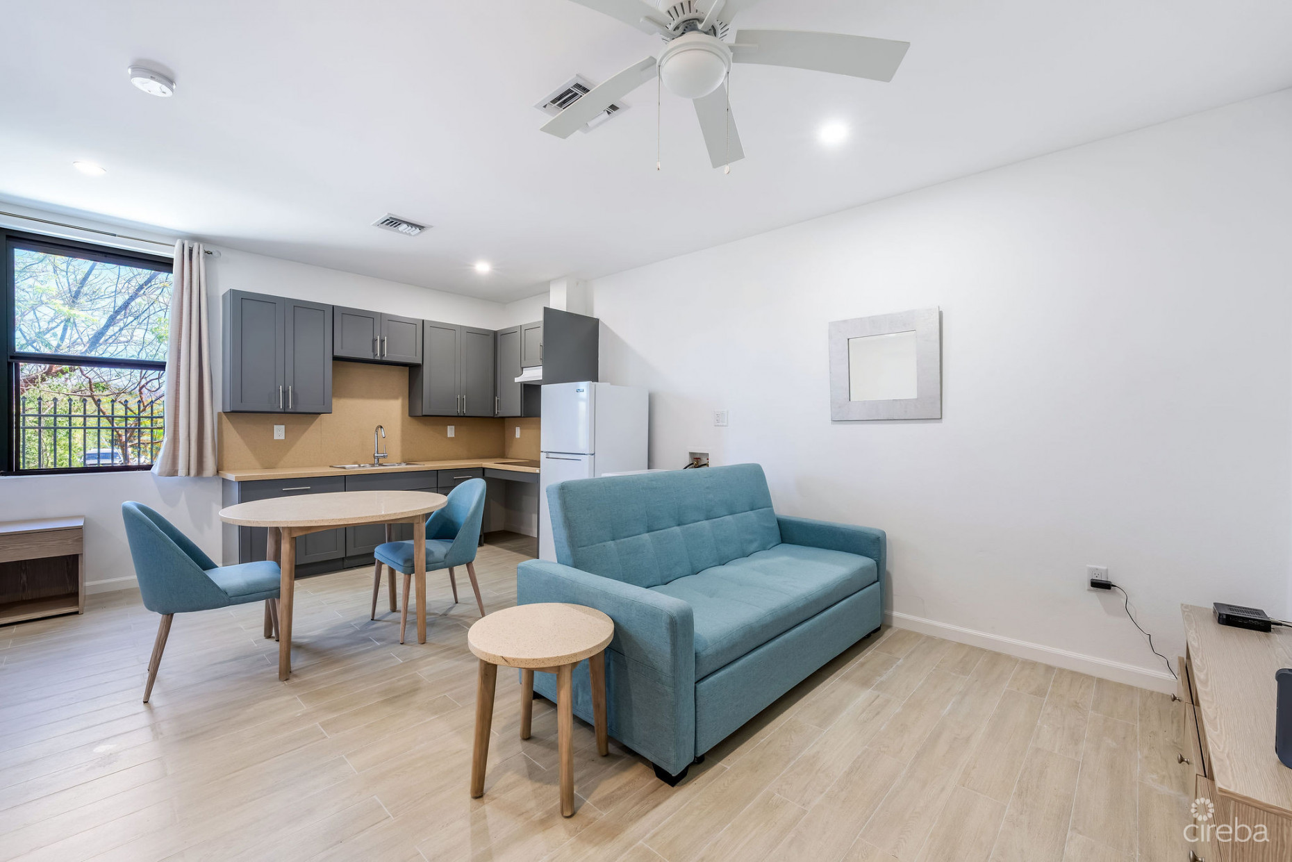 INCOME-PRODUCING RESIDENTIAL PORTFOLIO --4 STUDIOS IN WEST BAY