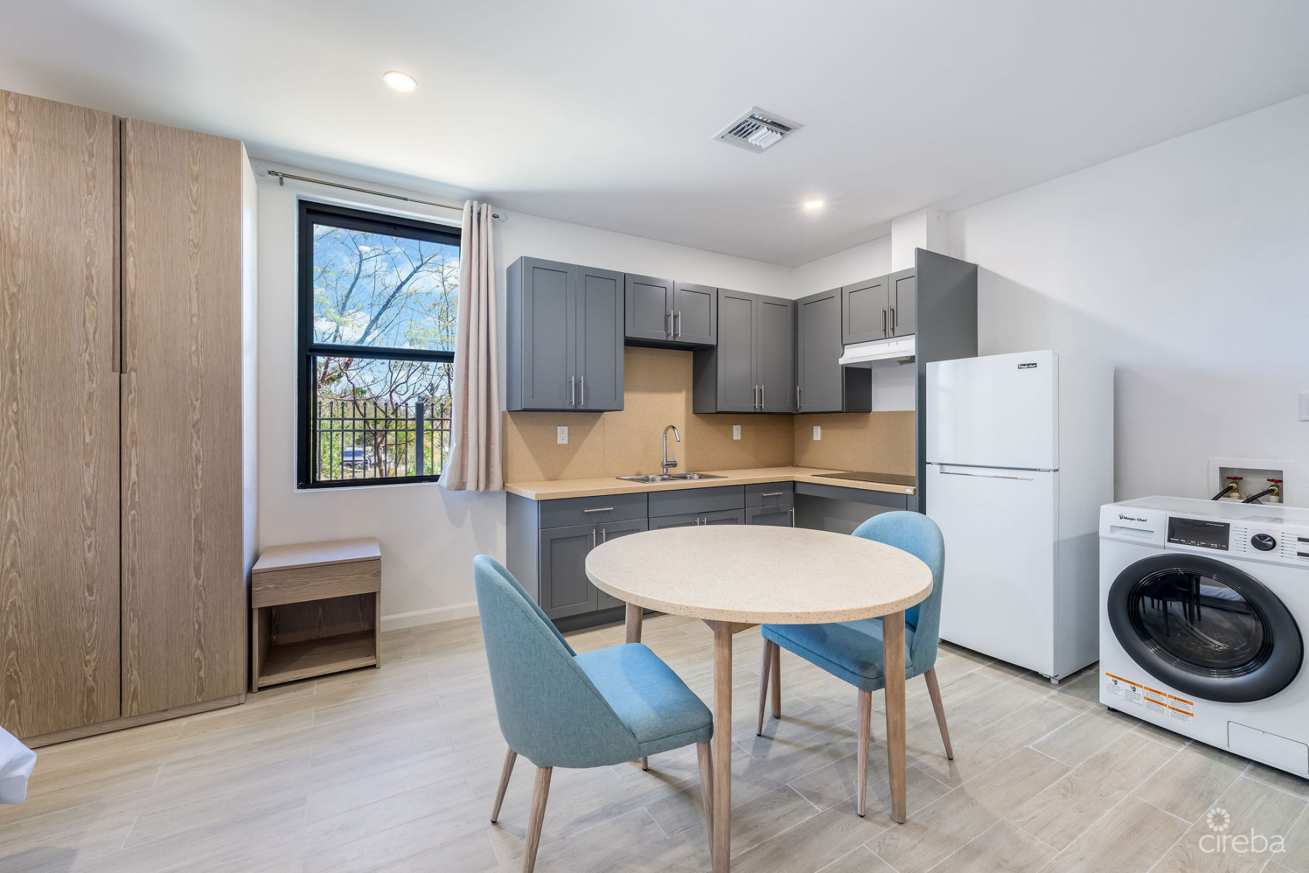 INCOME-PRODUCING RESIDENTIAL PORTFOLIO --4 STUDIOS IN WEST BAY