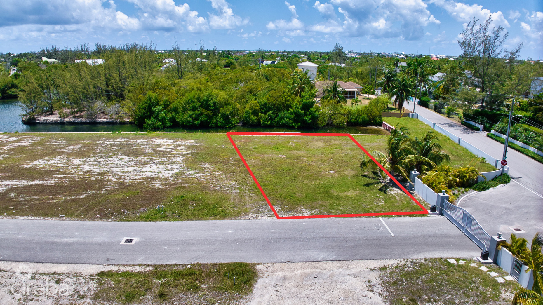 MUSTIQUE COVE LOT WITH DOCK IN A PRIVATE GATED COMMUNITY