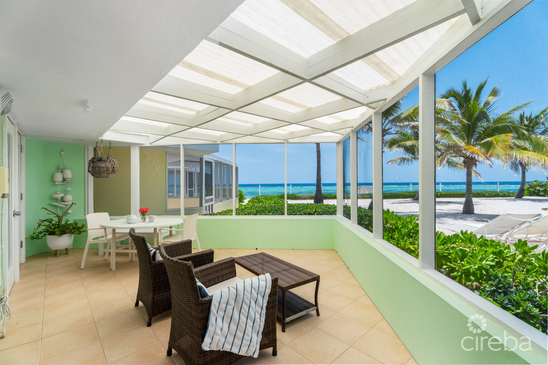 CAYMAN KAI SEA LODGE #13 BEACHFRONT CONDO WITH IMPRESSIVE RENTAL HISTORY