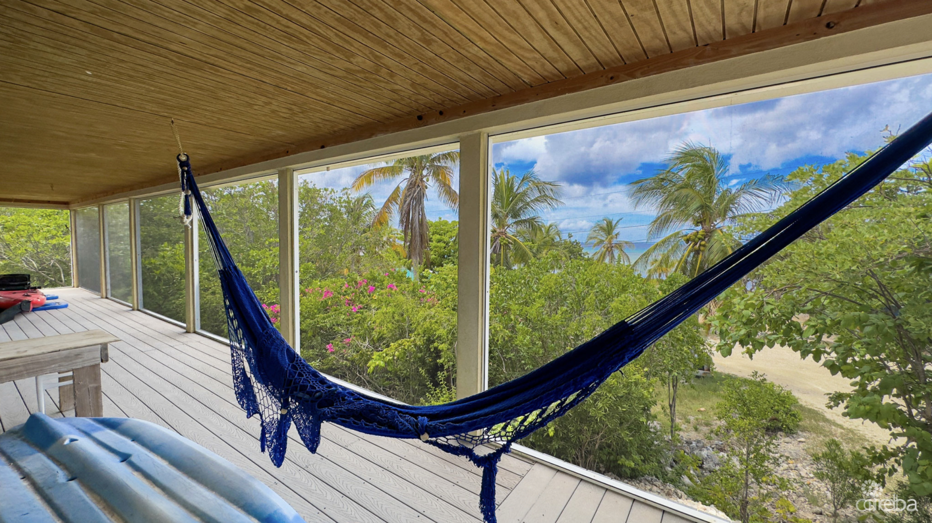 LITTLE CAYMAN OCEAN VIEW RESIDENTIAL HOME W/ BEACHFRONT LOT JUST SHY OF 1 ACRE