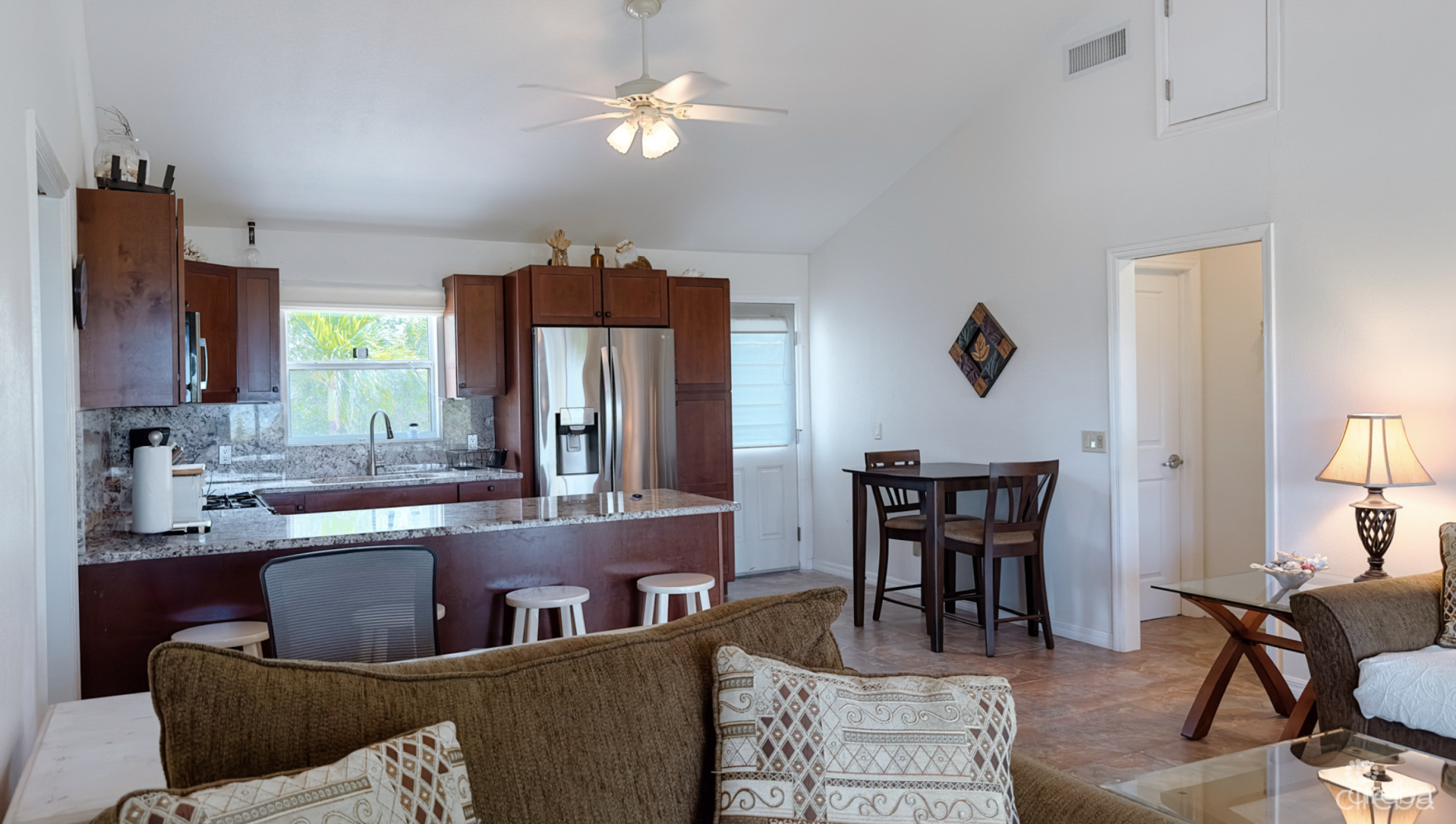 LITTLE CAYMAN OCEAN VIEW RESIDENTIAL HOME W/ BEACHFRONT LOT JUST SHY OF 1 ACRE