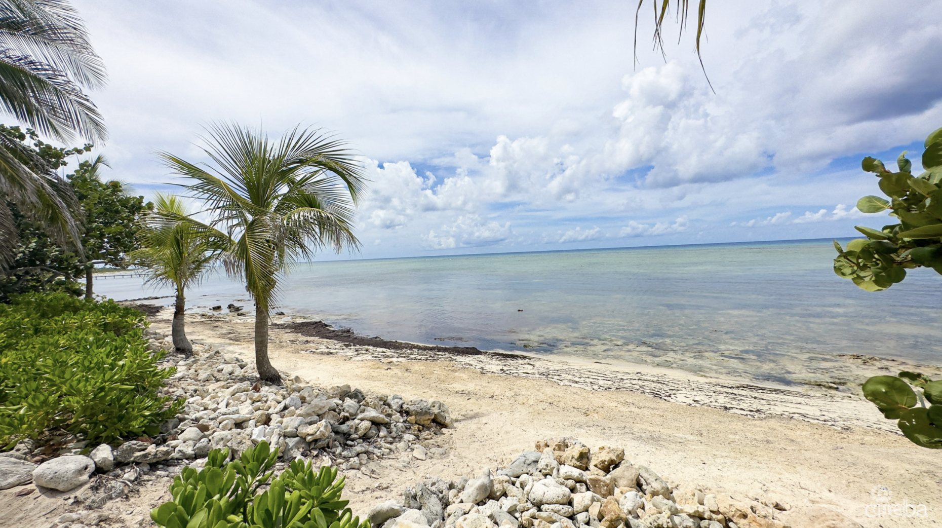 LITTLE CAYMAN OCEAN VIEW RESIDENTIAL HOME W/ BEACHFRONT LOT JUST SHY OF 1 ACRE