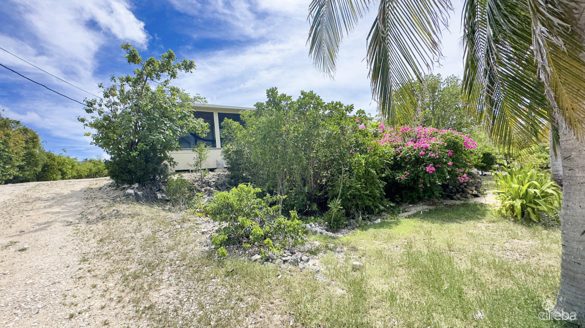 LITTLE CAYMAN OCEAN VIEW RESIDENTIAL HOME W/ BEACHFRONT LOT JUST SHY OF 1 ACRE