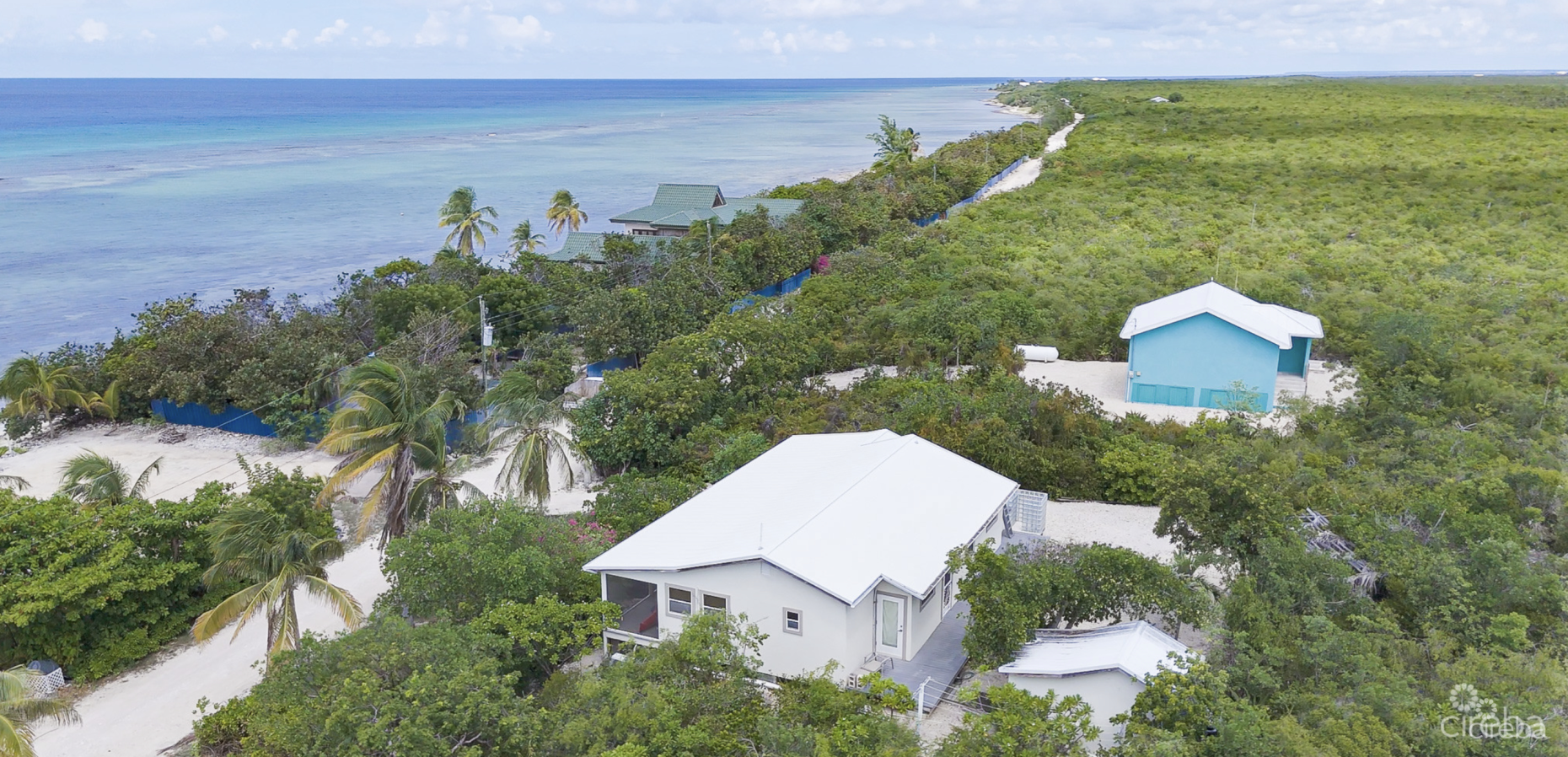 LITTLE CAYMAN OCEAN VIEW RESIDENTIAL HOME W/ BEACHFRONT LOT JUST SHY OF 1 ACRE