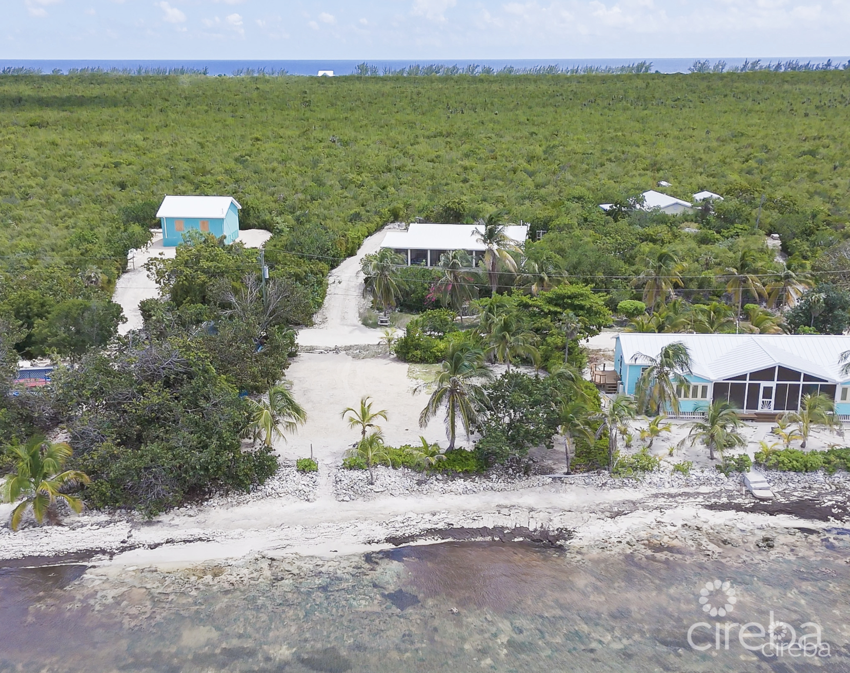 LITTLE CAYMAN OCEAN VIEW RESIDENTIAL HOME W/ BEACHFRONT LOT JUST SHY OF 1 ACRE